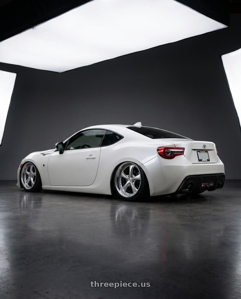 2017 Toyota 86 pearl white with Work Wheels VS-KF 5x114.3 18x9.5-23 Light Grey Silver O Disk FULL REVERSE wheels rear three quarter view slight stretch tires