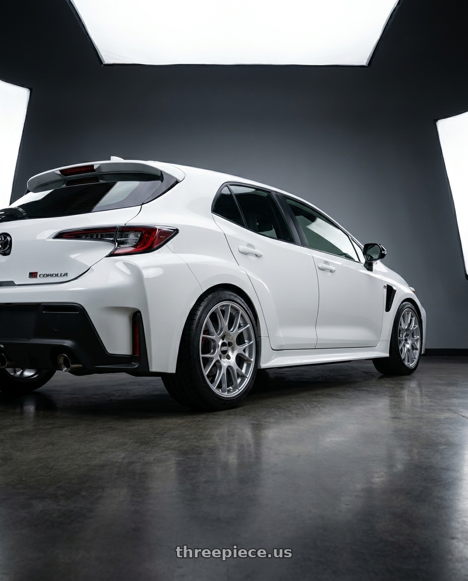 2022 Toyota gr corolla with BBS CH-R 5x112 18x8.5 +38 Brilliant Silver Polished Rim Protector wheels rear three quarter view square tires