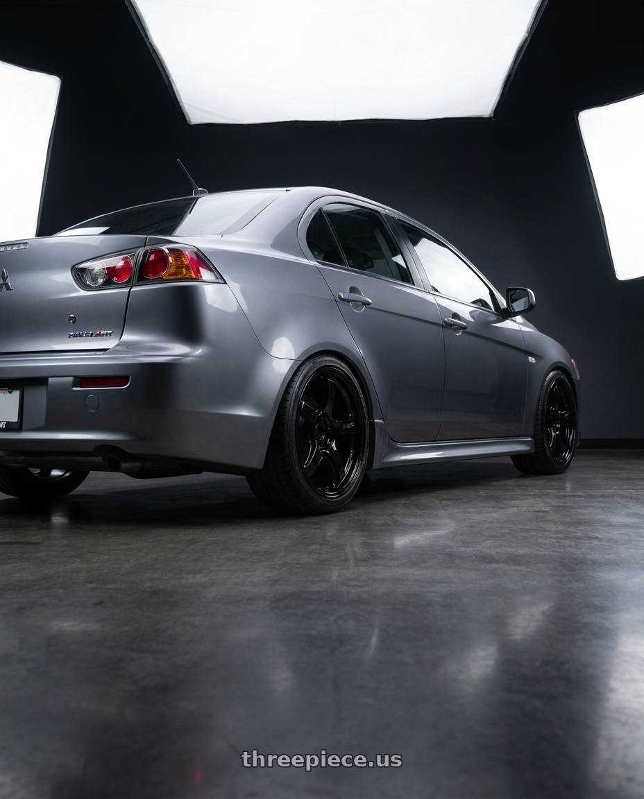 2014 Mitsubishi Lancer Ralliart with Gram Lights 57CR 5x114.3 18x10.5+12 Glossy Black wheels rear three quarter view square tires