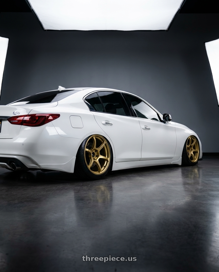 2020 Infiniti Q50 with Advan RGIII 5x114.3 19x10.5+15 Gold wheels rear three quarter view slight stretch tires