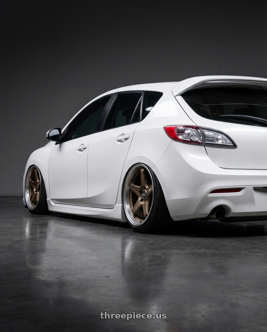 2012 Mazda Mazdaspeed3 with ESR Wheels APEX SERIES AP5 5x114.3 18x9.5 +35 Matte Bronze wheels rear three quarter view slight stretch tires