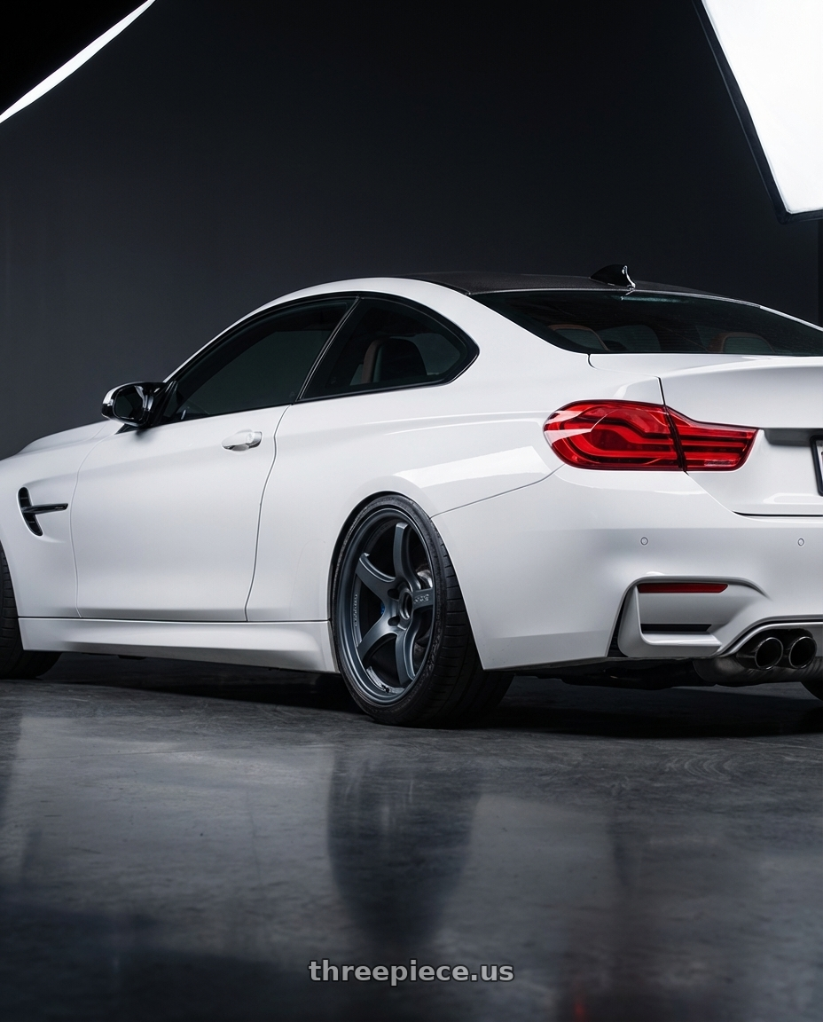 2018 BMW M4 F82 with Gram Lights 57CR 5x120 19x9.5+35 Gunblue II wheels rear three quarter view slight stretch tires