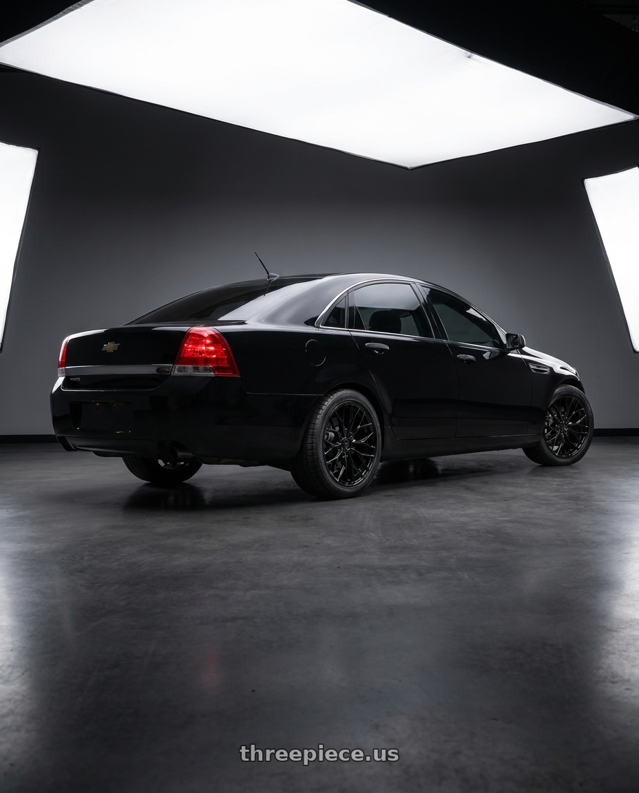 2014 Chevy caprice ppv with DOLCE PERFORMANCE MAGARI 5x120 19x9.5 +40 Gloss Black wheels rear three quarter view square tires