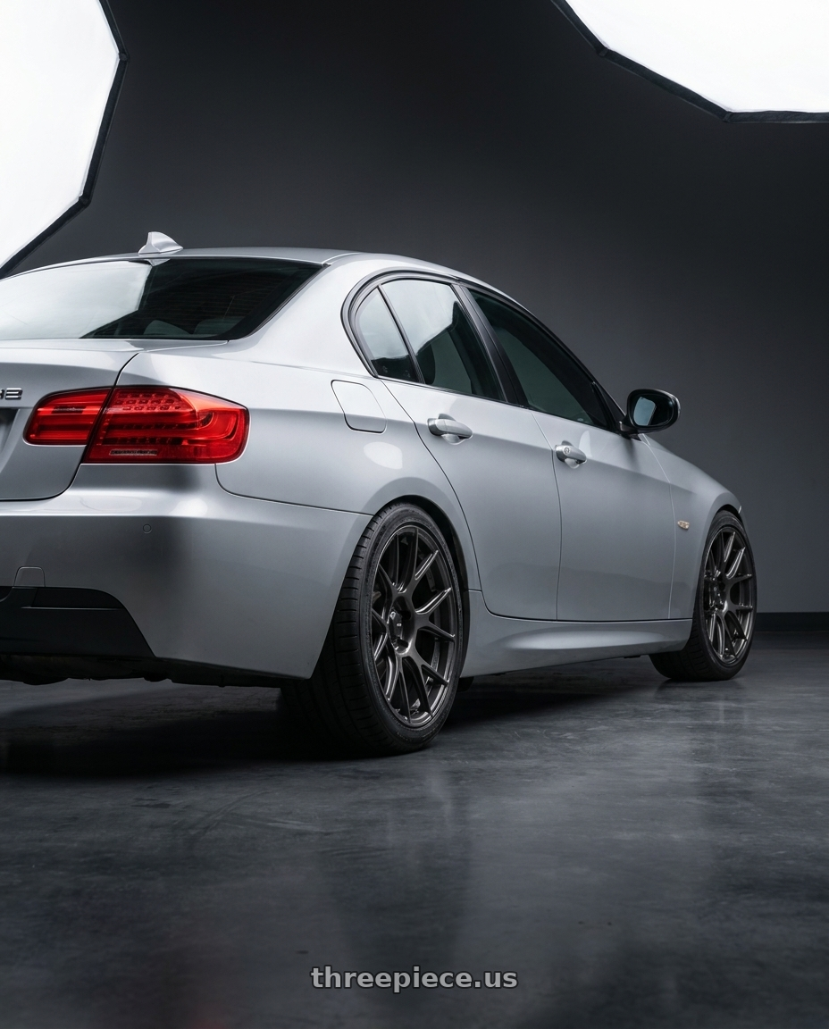 2012 BMW 3 Series E92 with Konig Ampliform 5x120 18x9.5+35 Dark Metallic Graphite wheels rear three quarter view square tires