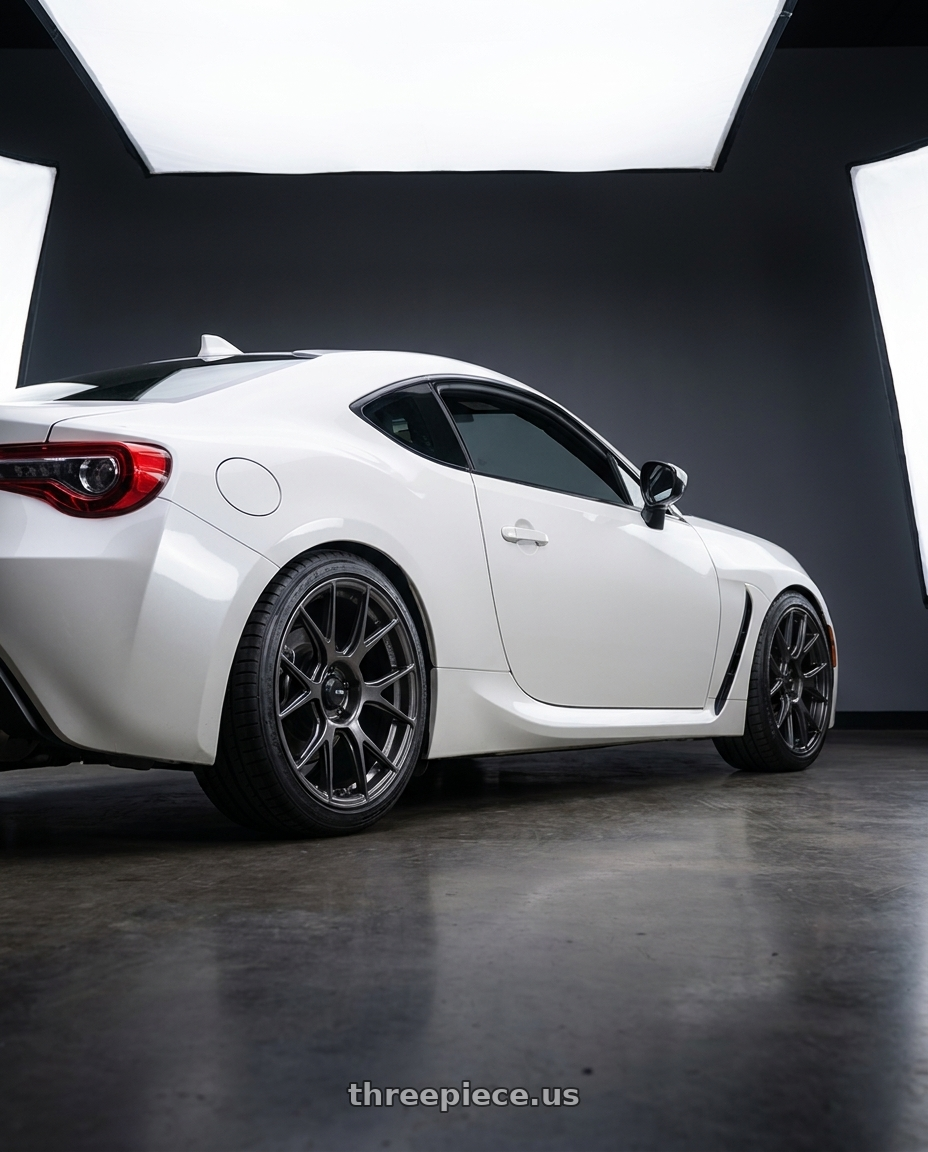 2016 Scion FR-S with Konig Ampliform 5x100 17x9+40 Dark Metallic Graphite wheels rear three quarter view square tires