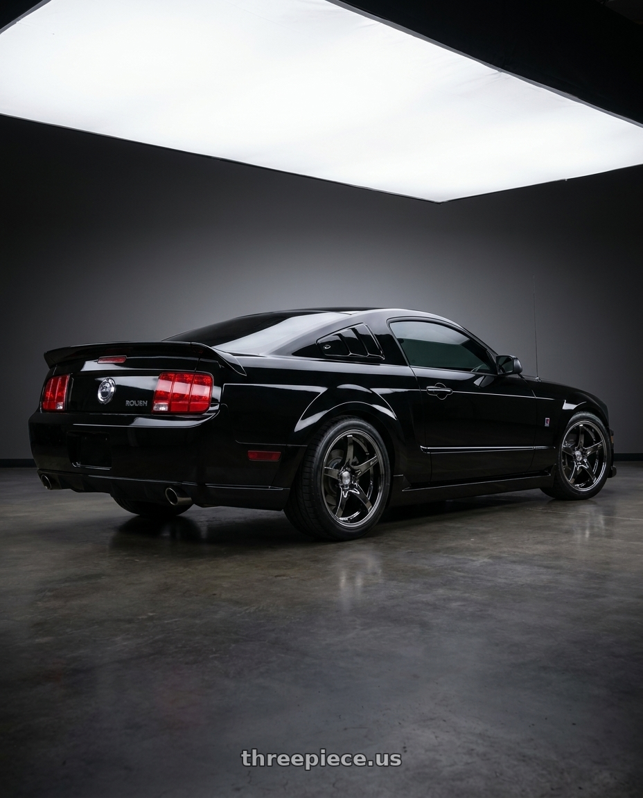 2005 Ford Mustang GT with Stage Wheels Monroe 5x114.3 18x10 +15 Black Chrome wheels rear three quarter view square tires