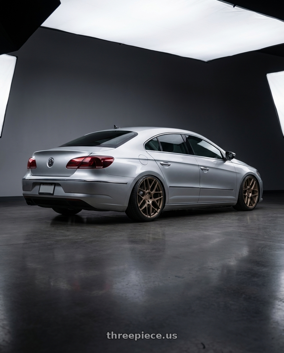 2015 Volkswagen CC with Aodhan AFF2 5x112 19x8.5+35 Matte Bronze wheels rear three quarter view slight stretch tires