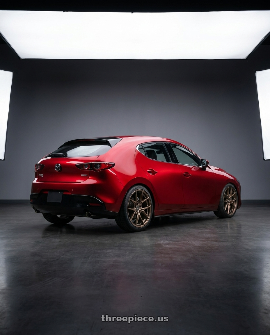 2026 Mazda 3 hatchback soul red with Enkei TSR-X 5x114.3 18x8.5+38 Gloss Bronze wheels rear three quarter view square tires