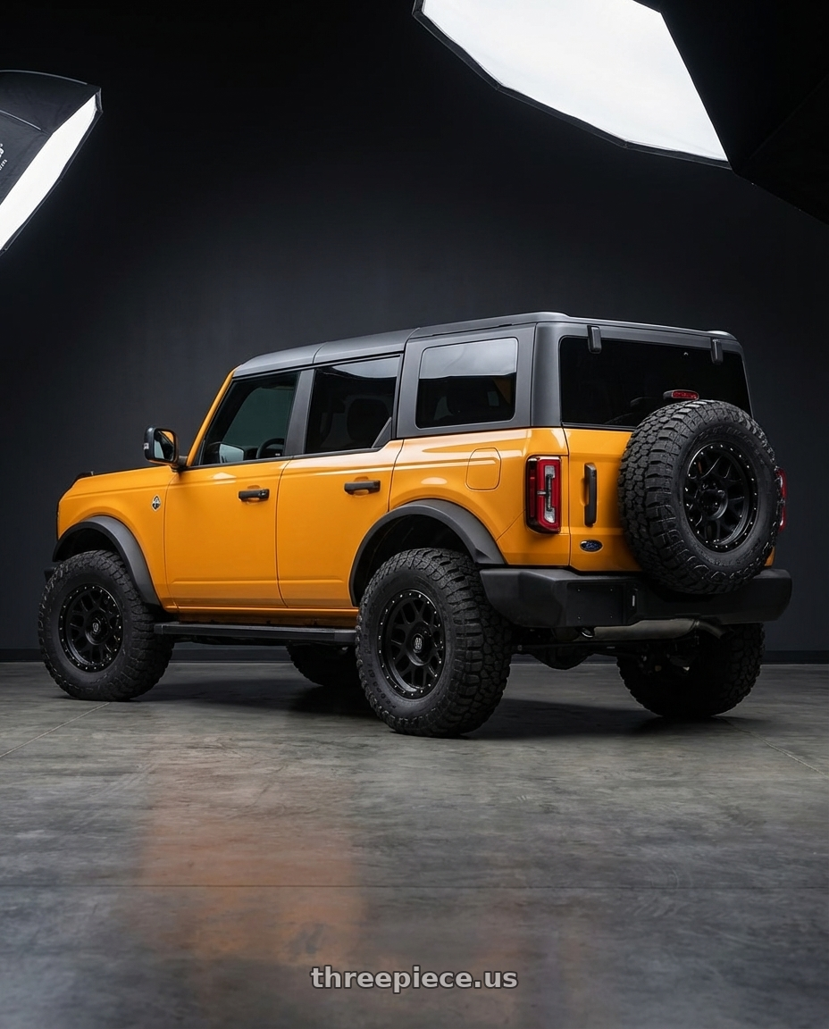 2024 Ford Bronco with XD XD127 BULLY 6X139.7 17X9 -12 SATIN BLACK WITH REINFORCING RING wheels rear three quarter view meaty tires