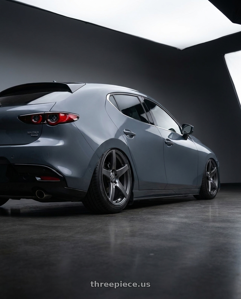 2023 Mazda Mazda3 Turbo with Forgestar CF5 5x114.3 18x10 +42 Gloss Anthracite wheels rear three quarter view slight stretch tires