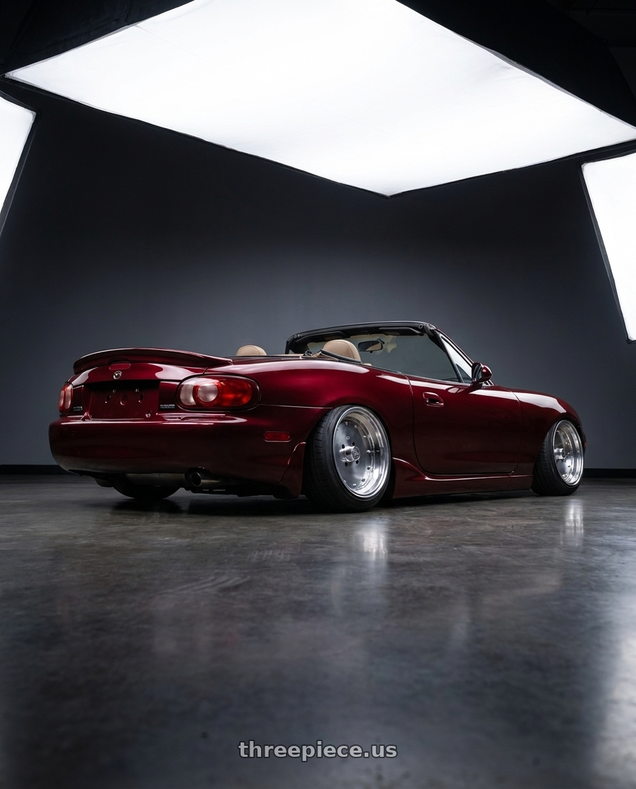 2000 Mazda miata with Speed Star Mk-I 4x100 15X9+-1  Polished wheels rear three quarter view slight stretch tires