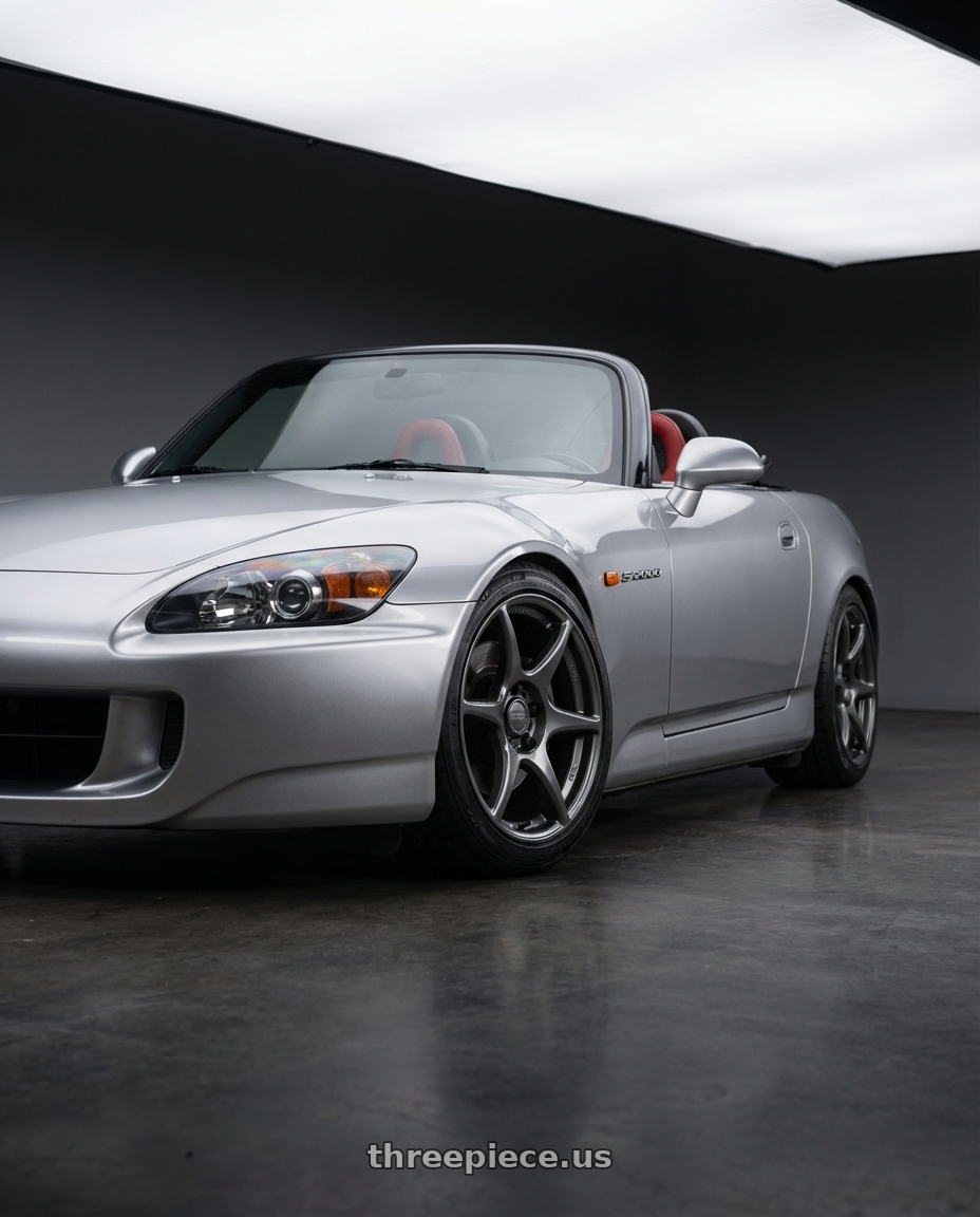 2009 Honda S2000 with Kansei K11G Tandem 5x114.3 17x9 22 Gunmetal wheels front three quarter view lowered stance