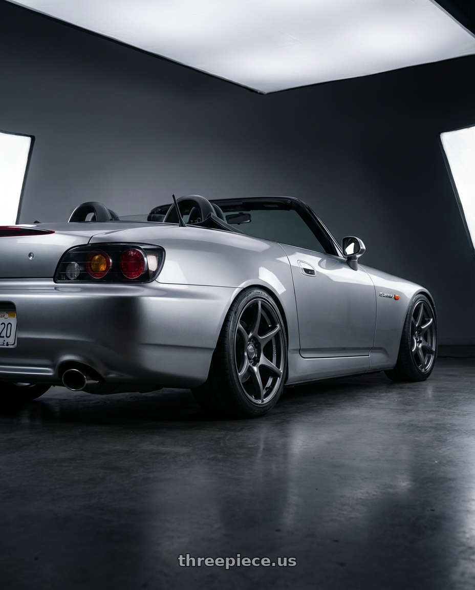 2009 Honda S2000 with Kansei K11G Tandem 5x114.3 17x9 22 Gunmetal wheels rear three quarter view square tires